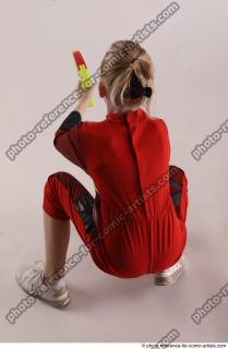 DENISA SITTING POSE WITH GUN